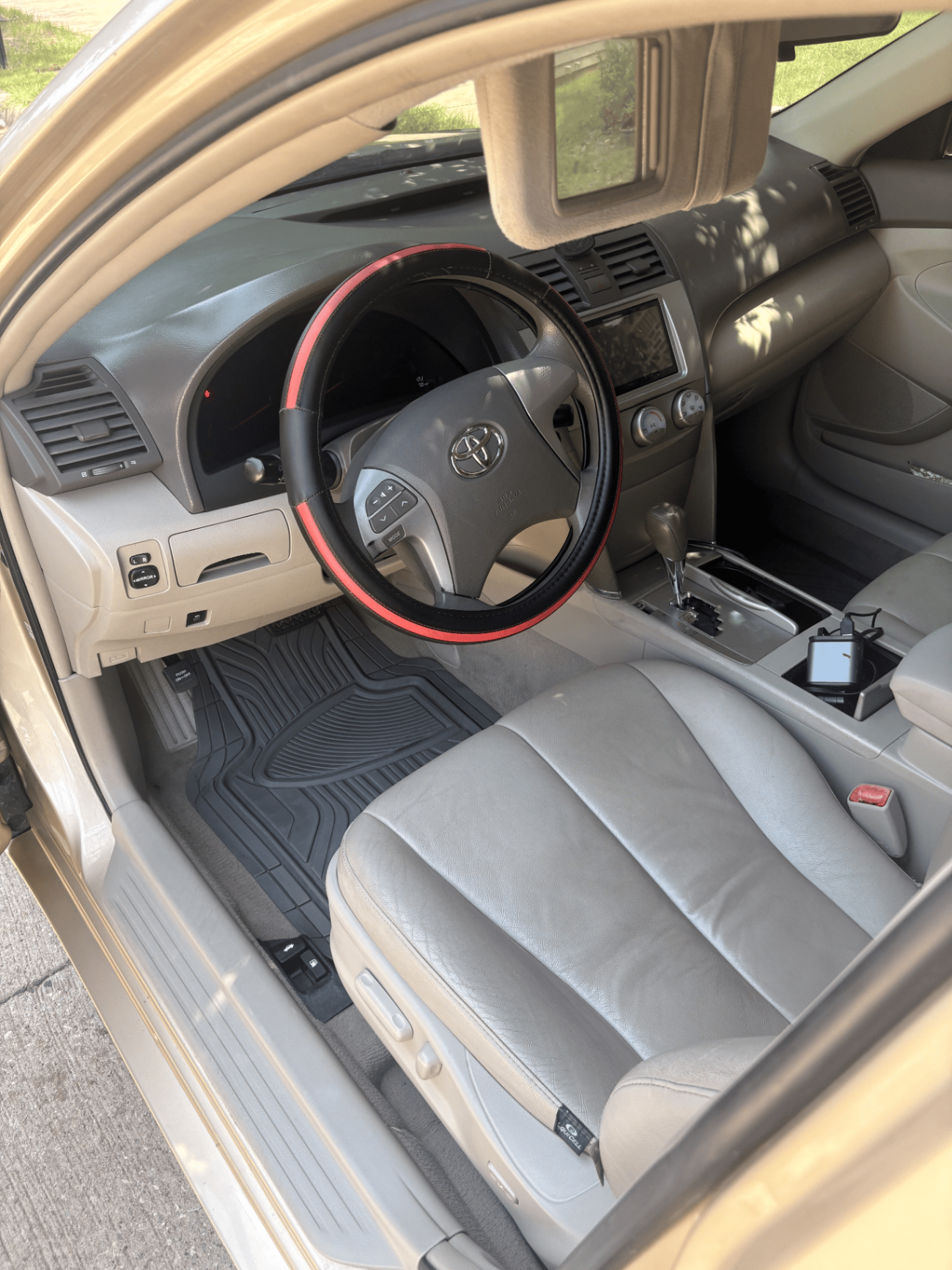 Toyota Camry interior after mobile detailing - steering wheel, dash and floor mat