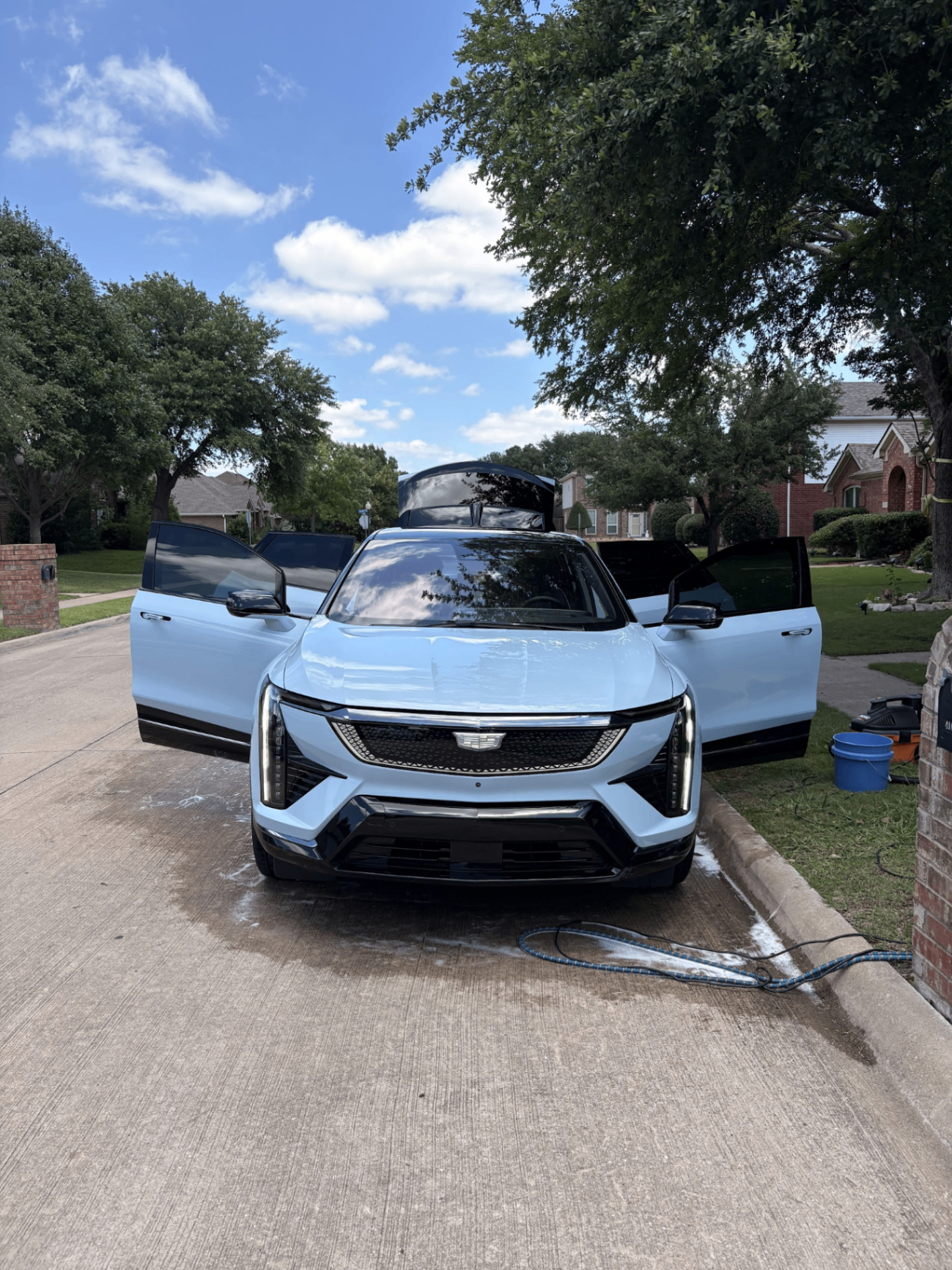 Cadillac Lyriq with doors open during full mobile detail